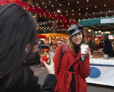 Woman taking a picture of her friend