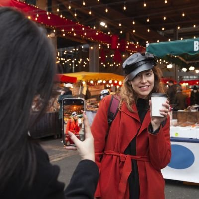 Woman taking a picture of her friend